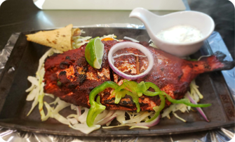 Thanal Indian Tavern signature dishes Thanal Lamb ShankAlleppey Fish CurryTandoori Chicken